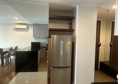 Modern kitchen with stainless steel refrigerator and washer