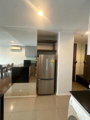 Modern kitchen with stainless steel refrigerator and washer