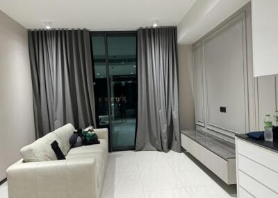 Modern living room with gray curtains and white sofa