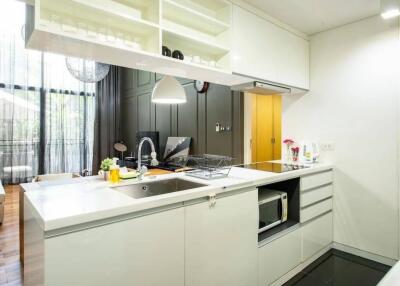 Modern kitchen with white cabinets and open shelving