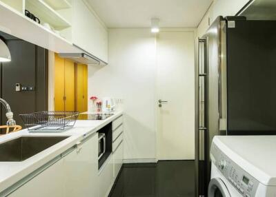 Modern kitchen with white cabinets and appliances