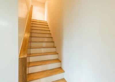 Staircase with wooden steps and railing