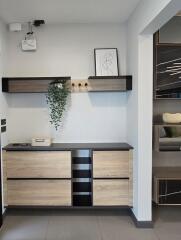 Hallway with storage and decorative shelving