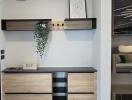 Hallway with storage and decorative shelving