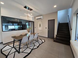 Modern dining area with contemporary furniture and decor