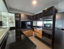 Modern kitchen with sleek black and wooden cabinetry