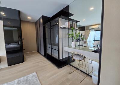 Modern bedroom with a study desk and large wardrobe