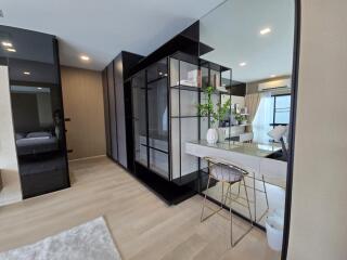 Modern bedroom with a study desk and large wardrobe