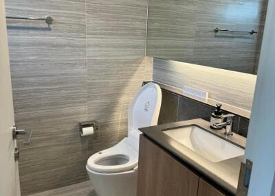 Modern bathroom with toilet and vanity