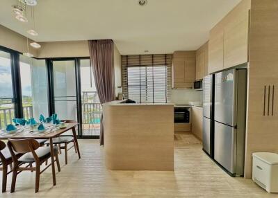 Modern kitchen with dining area and balcony access