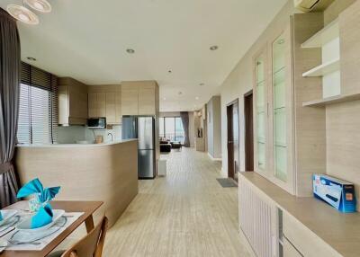 Modern kitchen and dining area with light wood finishes