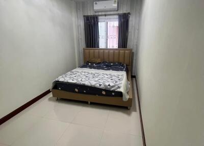 bedroom with bed and air conditioner