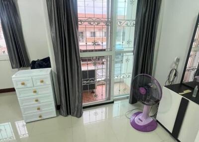 Bedroom with large window and view