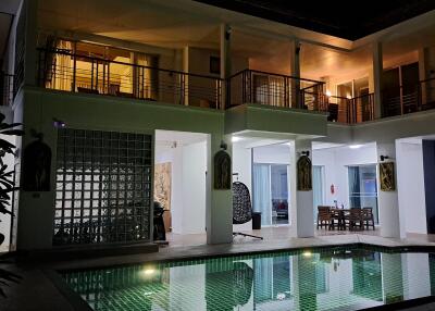 Luxury villa with pool at night