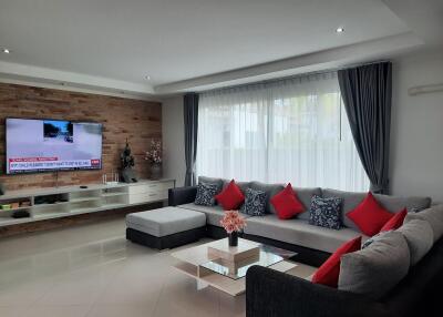 Modern living room with sectional sofa and large window