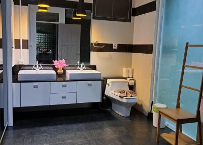 Spacious bathroom with double sinks and modern fixtures