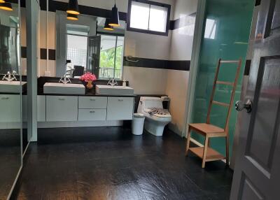 Modern bathroom with double sinks and large mirror