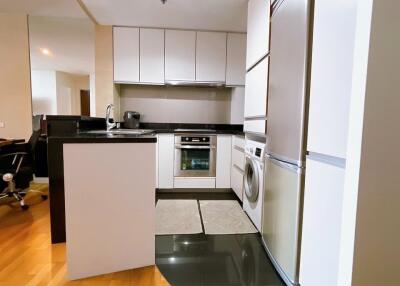 Modern kitchen with white cabinets and appliances