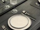 Elegant dining table set with glassware and plates