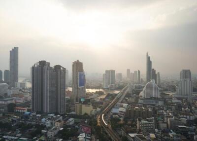 city skyline with high-rise buildings at sunset