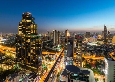 Stunning city skyline view at dusk with illuminated buildings