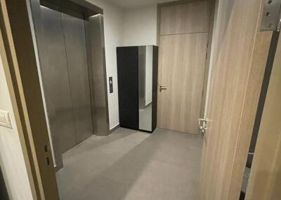 Elevator hallway with large mirror