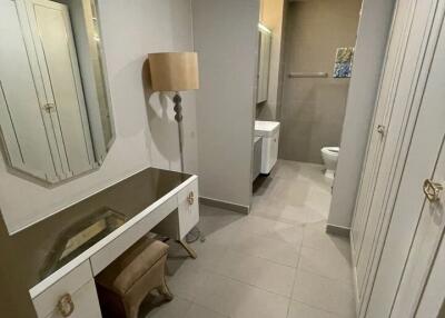 Bathroom with vanity table, mirror, and storage cabinets