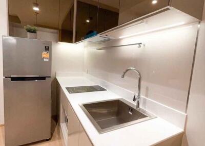 Modern kitchen with stainless steel appliances and sleek cabinetry