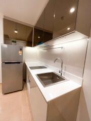 Modern kitchen with stainless steel appliances and sleek cabinetry