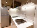 Modern kitchen with stainless steel appliances and sleek cabinetry