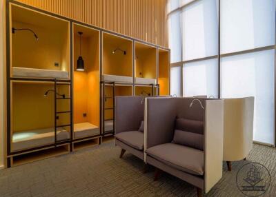 Modern shared bedroom with bunk beds and cozy seating area