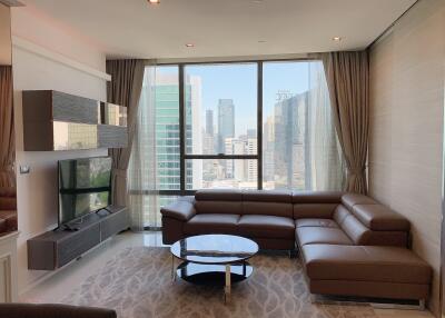 Modern living room with large windows and city view