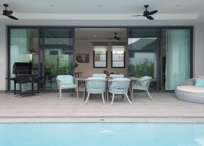 Outdoor dining area with pool