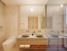 Modern and spacious bathroom with dual sinks and large mirror