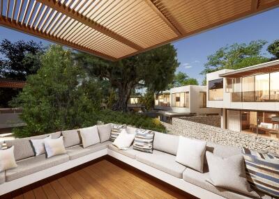 Outdoor living space with a comfortable L-shaped sofa and a pergola