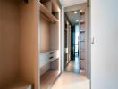 Walk-in closet with wooden shelves and drawers