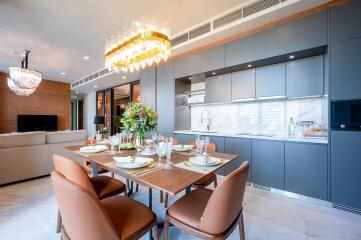 Modern kitchen and dining area with chandelier lighting