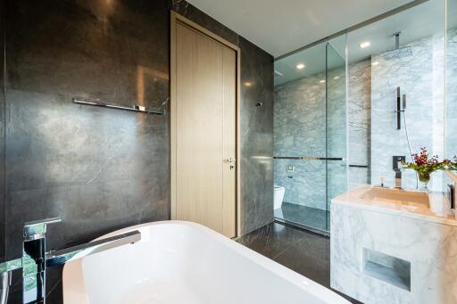 Modern bathroom with marble and glass features