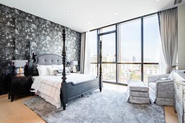 Modern bedroom with large window and city view