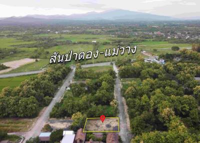 Aerial view of properties with landscape and mountain in background