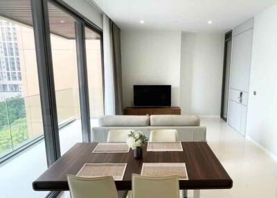 Modern living and dining area with large windows