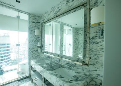 modern bathroom with marble decor and double sinks