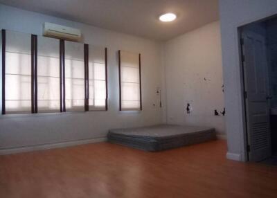 Empty bedroom with mattresses and windows