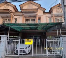 Front view of a townhouse with a covered garage