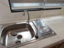 Modern kitchen sink with marble countertop