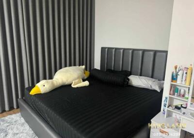 Contemporary bedroom with a plush toy on a modern bed