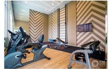 Modern fitness room with gym equipment