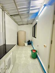 Utility Room with Water Storage Tank and Plumbing