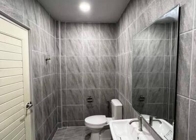 Modern bathroom with tiled walls and floor