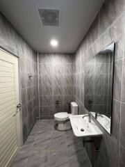 Modern bathroom with tiled walls and floor